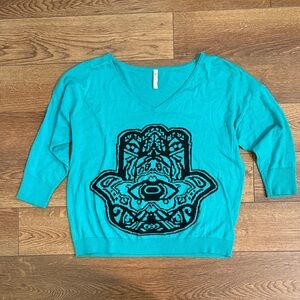 Teal V-Neck Sweater with Black Hamsa Design